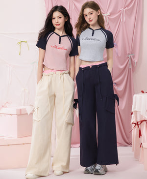 The Playmakers Crop Raglan Baby Tee